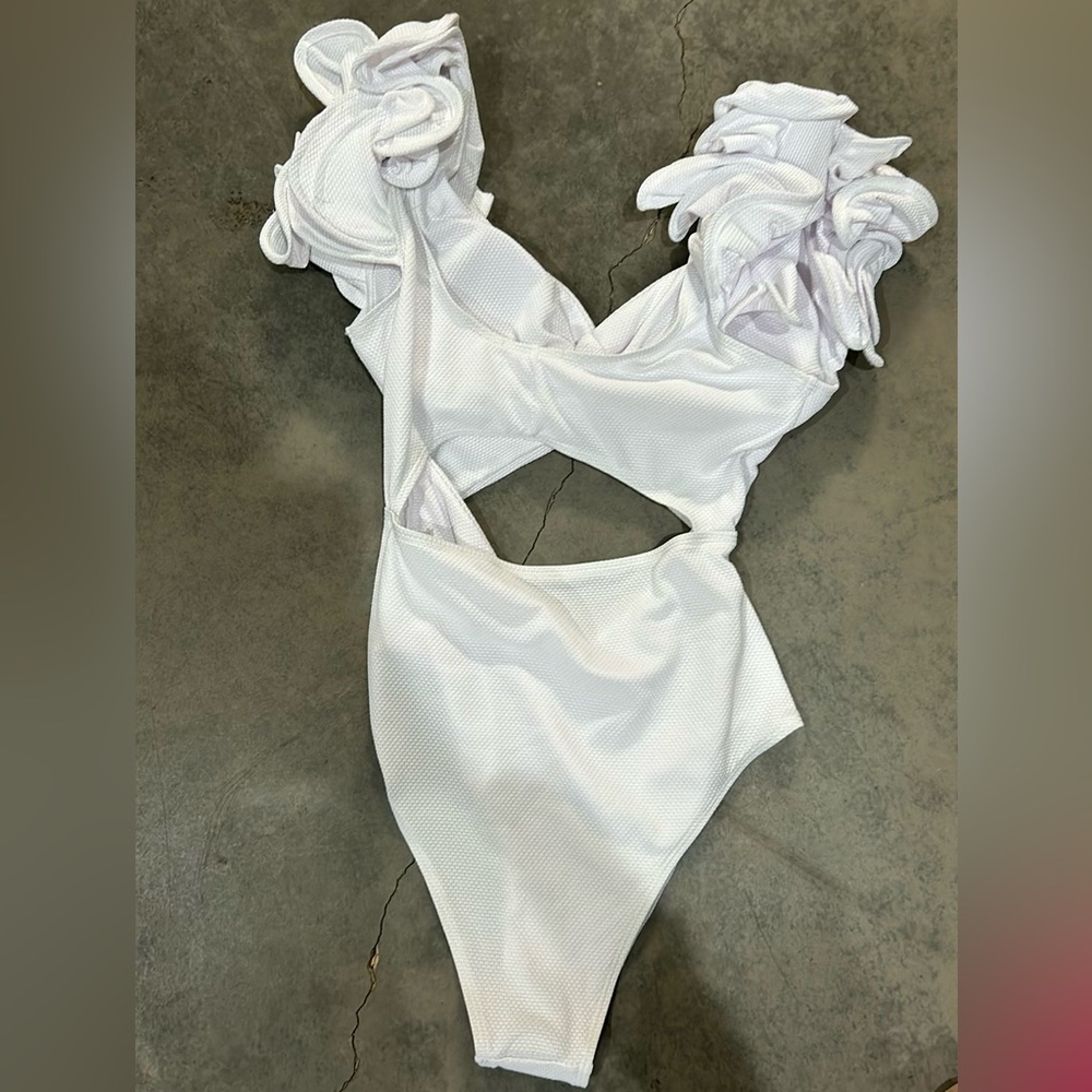 A super cute white one piece Buddy Love swimsuit!
